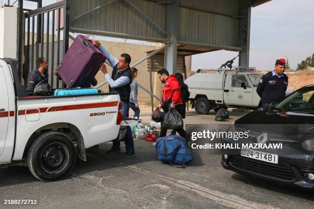 Syrians wait to cross through Jordan's Jaber crossing and into Syria on December 8 following the fall of the Syrian regime in Damascus. Jordanian...