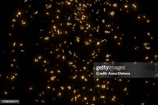 many festive blurred golden confetti on black background. concept of new year or birthday celebration. perfect backdrop for your design - confetti stock pictures, royalty-free photos & images