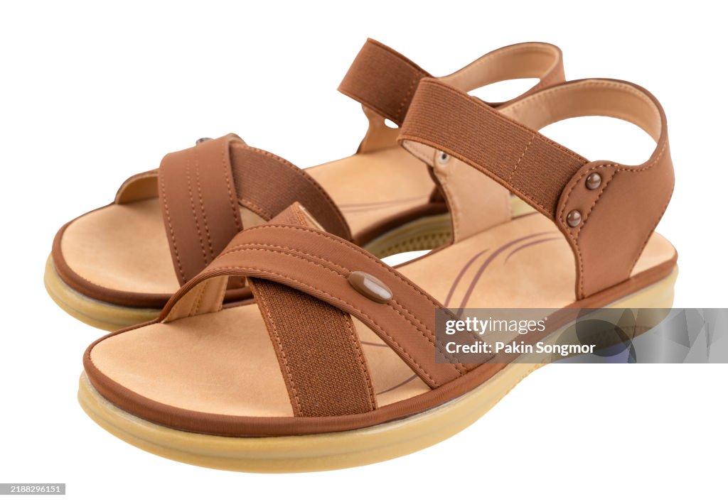 Women's beach brown color slippers shoes isolated on white background, Save clipping path.