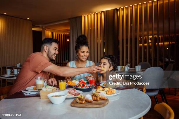 family having breakfast in hotel - restaurant stock pictures, royalty-free photos & images