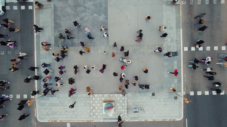 https://media.gettyimages.com/id/2188359197/video/aerial-view-of-pedestrians-walking-across.jpg?b=1&s=640x640&k=20&c=P14uTJc3I9kaCtZTJNJDpEarA6Pe9Jc-gN7cU5YHDHo=