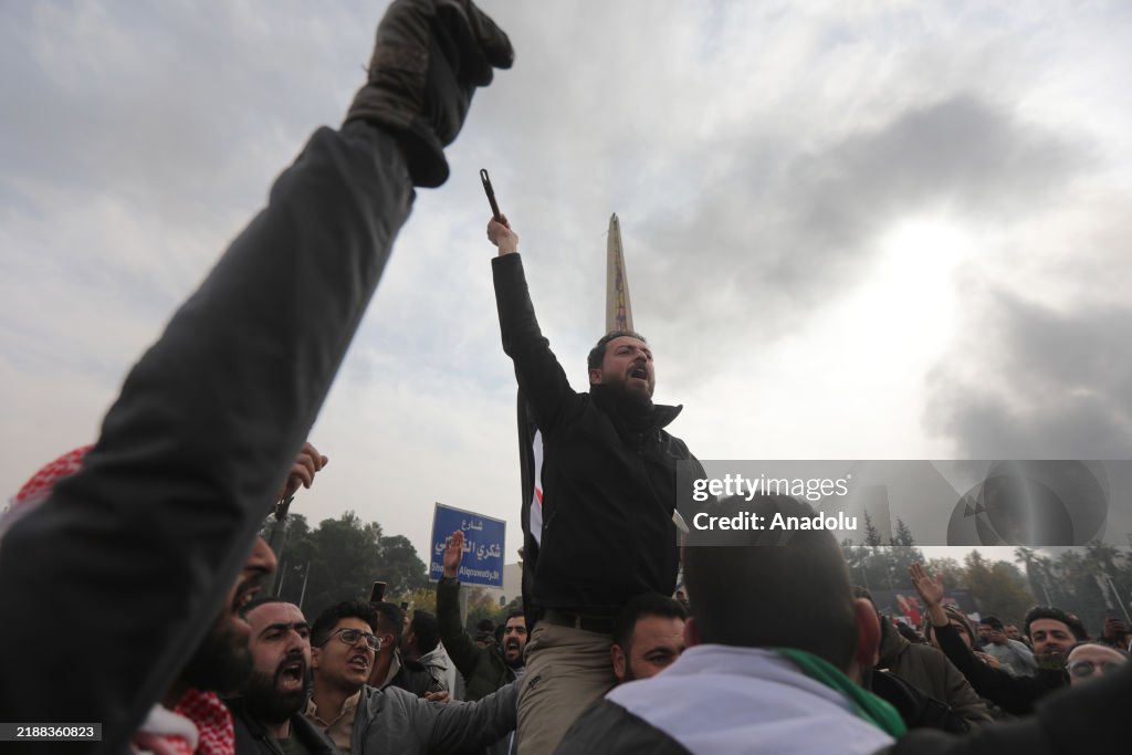Syrians celebrate the overthrow of the 61-year Baath Party rule