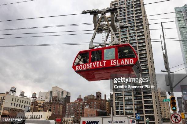 People ride the Roosevelt Island Tramway on December 05, 2024 in New York City. The Tram, constructed for residents of Roosevelt Island to get to and...