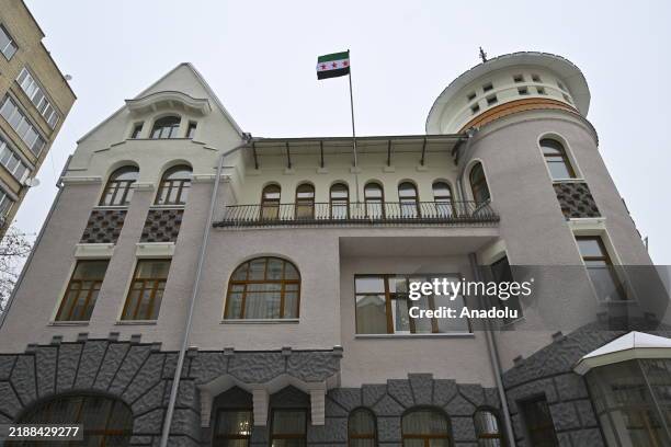 Syrian opposition's 'revolution flag' flies at the Syrian embassy after the overthrow of the 61-year Baath Party rule, in Moscow, Russia on December...