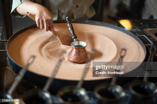 turkish sand coffee making. - coffee pot stock pictures, royalty-free photos & images