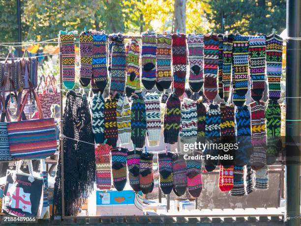 wool socks for sale at the flea market near dry bridge, tbilisi - crazy socks stock pictures, royalty-free photos & images