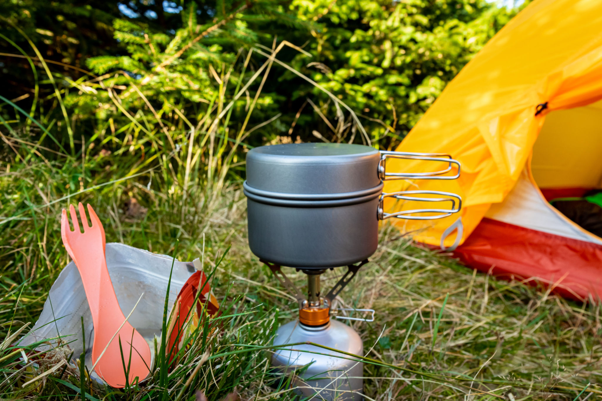 Equipment for camping and cooking on a mountain hike. Equipment for camping and cooking on a mountain hike.