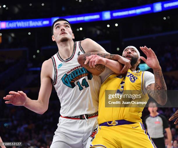 Anthony Davis of the Los Angeles Lakers and Zach Edey of the Memphis Grizzlies wait for a rebound during the game on November 13, 2024 at Crypto.com...