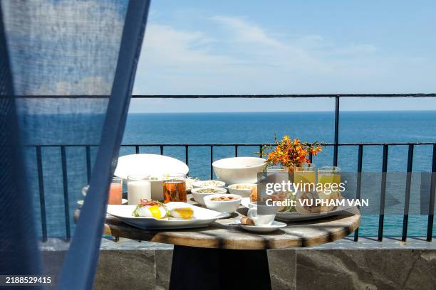 breakfast table for two by balcony with ocean view - colazione foto e immagini stock