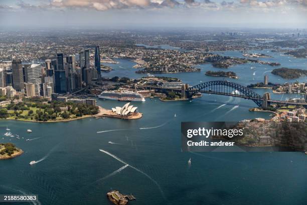 sydney harbor shot from a drone showing the bridge and the opera house - sydney opera house stock pictures, royalty-free photos & images