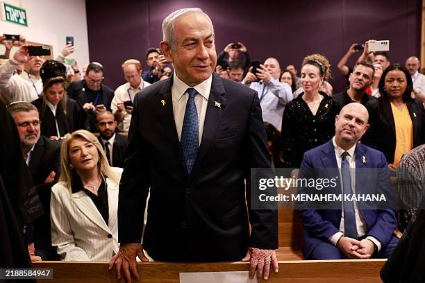 Israeli Prime Minister Benjamin Netanyahu attends a hearing in his trial on corruption charges at the district court in Tel Aviv on December 10,...