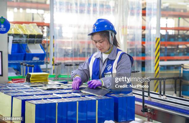 Worker produces energy storage batteries at Nantong Guoxuan New Energy Technology Co., Ltd. In Nantong High-tech Zone, East China's Jiangsu province,...