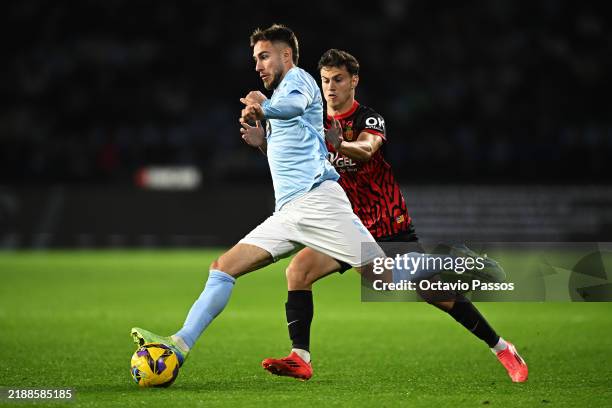 Oscar Mingueza of Celta Vigo and Javi Llabres of RCD Mallorca battle for the ball during the LaLiga match between RC Celta de Vigo and RCD Mallorca...
