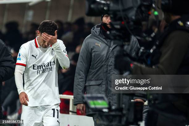 Christian Pulisic of AC Milan shows his dejection after his injury during the Serie A match between Atalanta and AC Milan at Gewiss Stadium on...