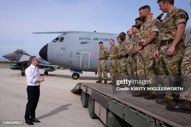 Britain's Prime Minister Keir Starmer talks to soldiers at the RAF base in Akrotiri on the southern coast of Cyprus on December 10, 2024.