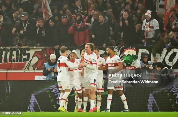 Nick Woltemade of VfB Stuttgart celebrates scoring his team's second goal with teammates during the Bundesliga match between VfB Stuttgart and 1. FC...