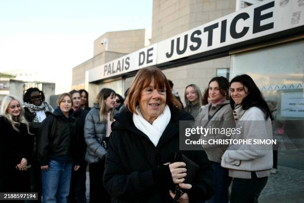 Gisele Pelicot reacts in front of young supporters, gathered at the Avignon courthouse, for the trial of her former partner Dominique Pelicot accused...