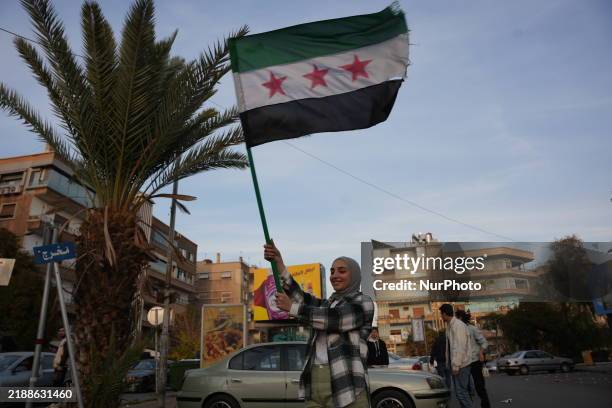 Syrians gather in the Abu Rummaneh neighborhood in central Damascus to celebrate the fall of the Assad regime on December 9, 2024.
