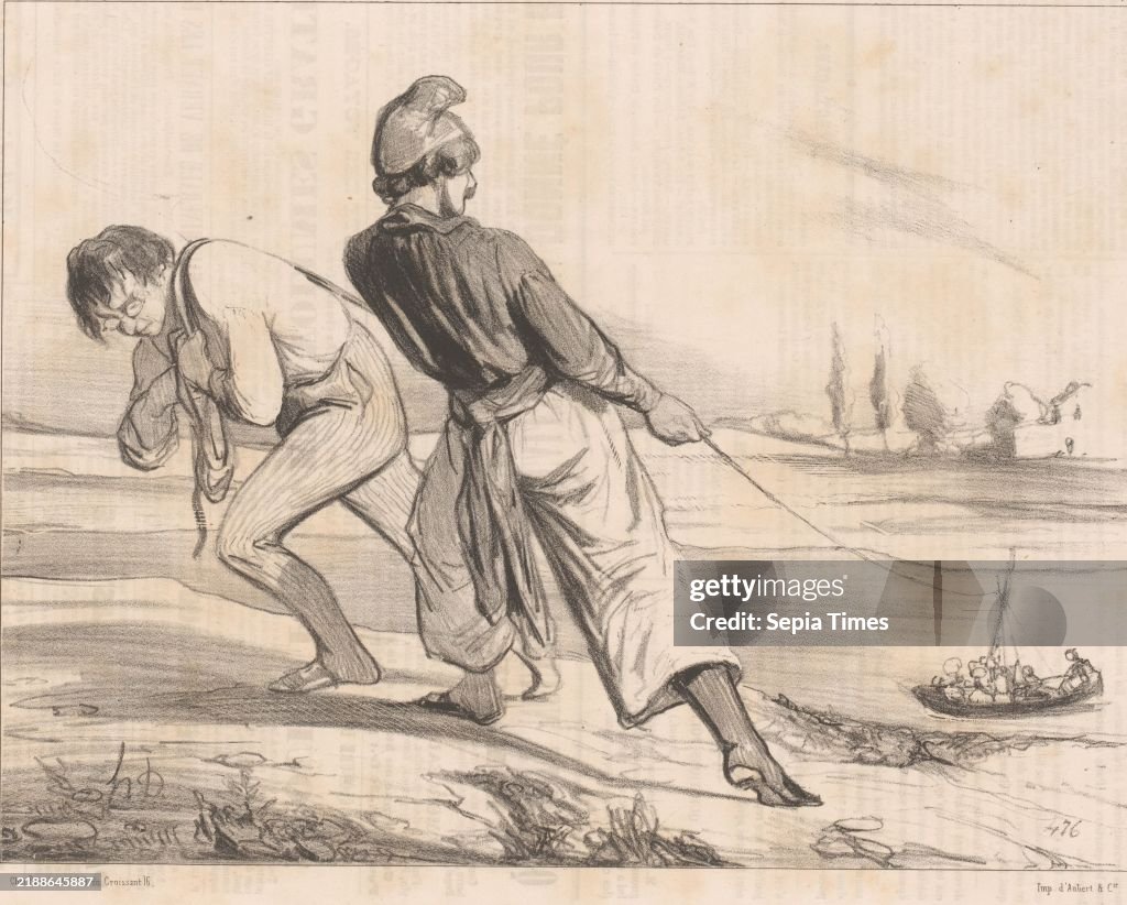 Two skippers pull a boat to shore