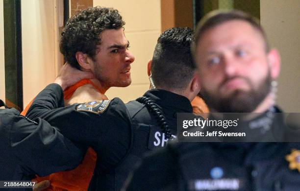 Suspected shooter Luigi Mangione is led into the Blair County Courthouse for an extradition hearing December 10, 2024 in Hollidaysburg, Pennsylvania....