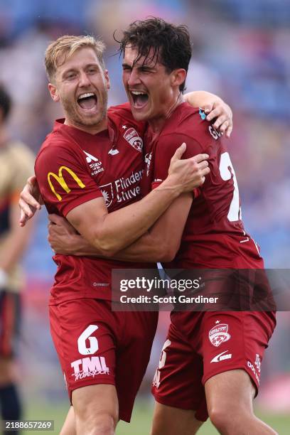 Stefan Mauk of Adelaide United celebrates a goal with Archie Goodwin of Adelaide United during the round seven A-League Men match between Newcastle...