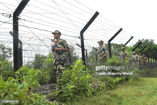Security personals of the Border Security Force providing tight security and patrolling the India- Bangladesh fencing in Nischinta Pur area, in...