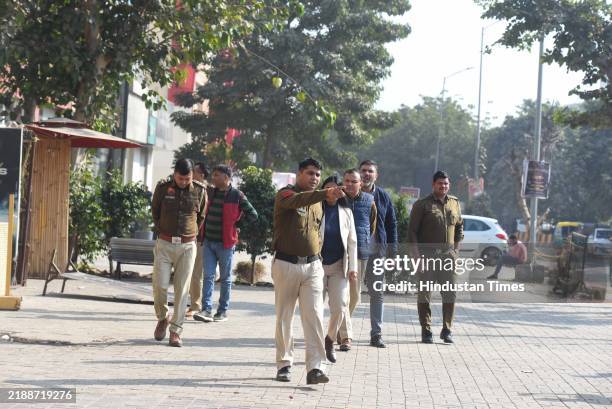 Team of National Investigation Agency and Gurugram police investigation at the spot where a crude bomb was thrown outside a club in sector-29 in...