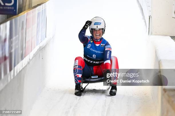 Emily Sweeney of the United States celebrates in the finish area during the FIL Luge World Cup Women's Singles final run at Olympia-Eiskanal Igls on...