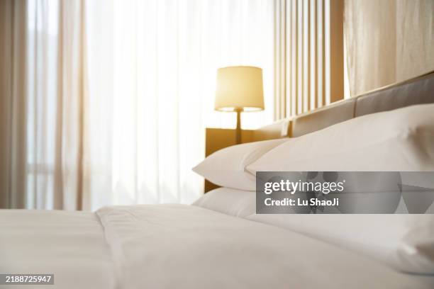 comfortable bed in modern hotel. - hotel suite stock pictures, royalty-free photos & images