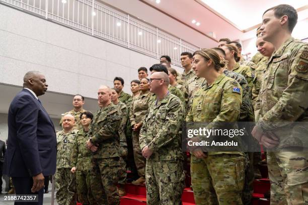 Secretary of Defense Lloyd Austin addresses military personnel from Japan, the United States, and Australia during a visit to Camp Asaka, a Japan...