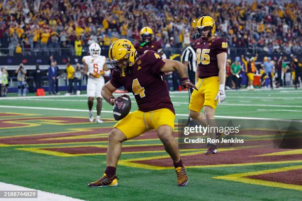Cam Skattebo of the Arizona State Sun Devils celebrates after his rushing touchdown against the Iowa State Cyclones during the second quarter of the...
