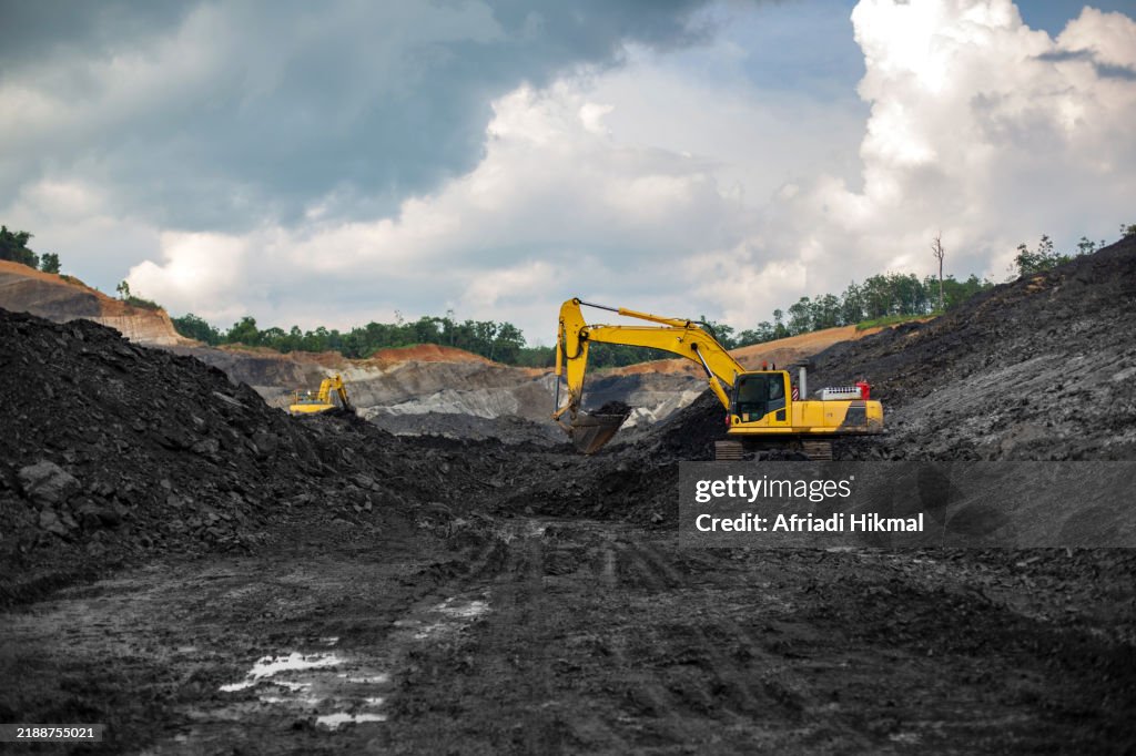 Digger Lifting Coal