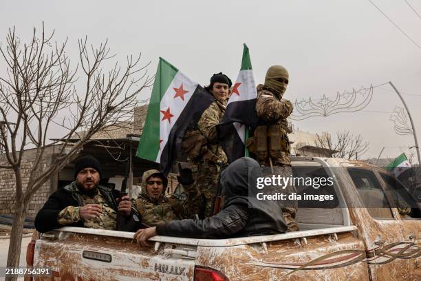 Syrian National Army soldiers celebrate victory in Manbij on December 7, 2024 in Manbij, Syria. The SNA has launched an operation on Manbij, which...