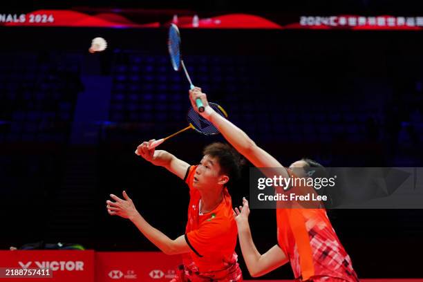 Jiang Zhen Bang and Wei Ya Xin of China compete in the Mixed Doubles match against Huang Yaqiong and Zheng Siwei of China during day one BWF World...