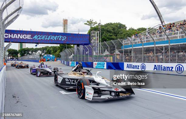 Mitch Evans of New Zealand driving the Jaguar TCS Racing Jaguar I-TYPE 7 leads Antonio Felix da Costa of Portugal driving the TAG Heuer Porsche...
