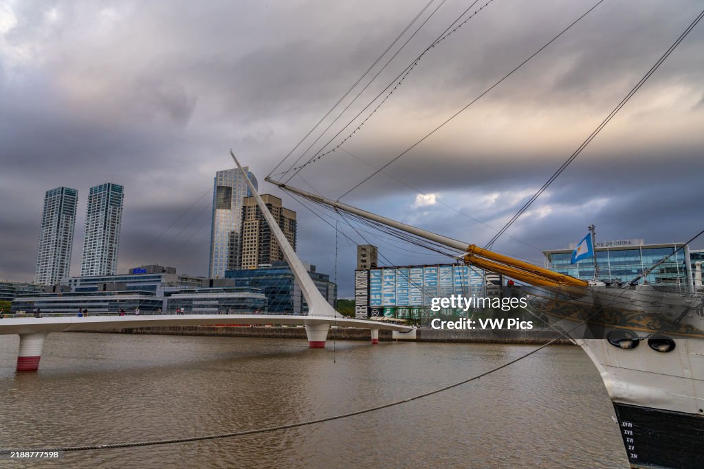 The bowsprit of the ARA Presidente Sarmiento & the Woman's Bridge over Dock 3 in Puerto Madero, Buenos Aires, Argentina