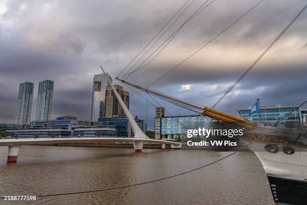 The bowsprit of the ARA Presidente Sarmiento & the Woman's Bridge over Dock 3 in Puerto Madero, Buenos Aires, Argentina.