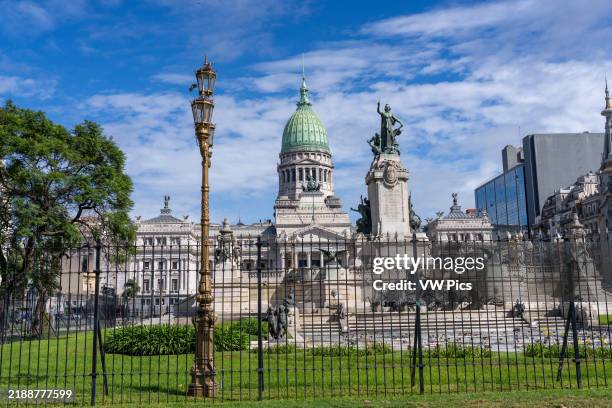 The National Congress Building behind the Monument of the Two Congresses in Buenos Aires, Argentina.