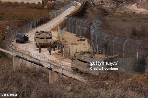 Israeli tanks at the border fence along the buffer zone with Syria seen from the Golan Heights, on Wednesday, Dec. 11, 2024. The United Arab Emirates...