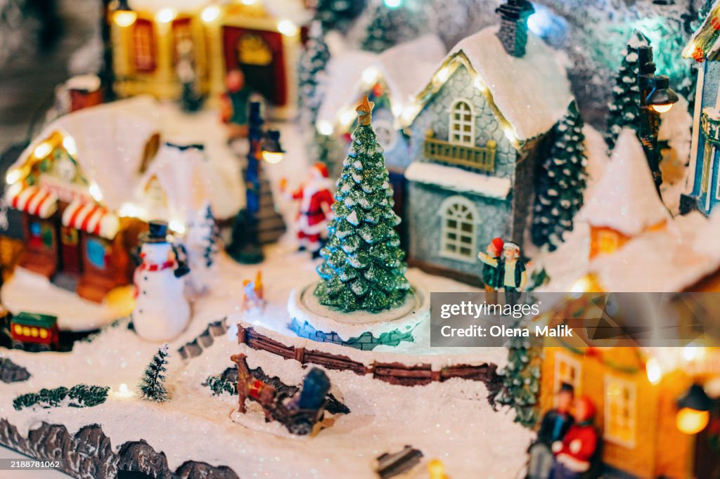 Festive Miniature Christmas Village Scene With Snow And Decorations