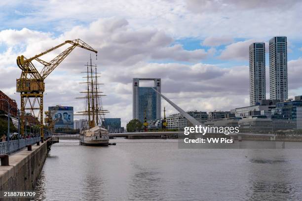 Dock 3 with the Woman's Bridge, ARA Presidente Sarmiento & skyline of Puerto Madero, Buenos Aires, Argentina. View to the north from the bridge...