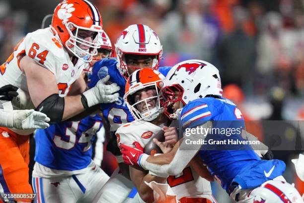 Jonathan McGill of the SMU Mustangs sacks Cade Klubnik of the Clemson Tigers during the fourth quarter of the 2024 ACC Football Championship at Bank...