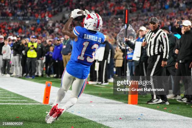 Roderick Daniels Jr. #13 of the SMU Mustangs catches a touchdown during the fourth quar of the 2024 ACC Football Championship at Bank of America...
