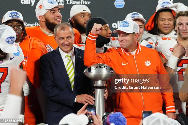 Dabo Swinney, Cade Klubnik and the Clemson Tigers celebrate after winning the 2024 ACC Football Championship at Bank of America Stadium on December...