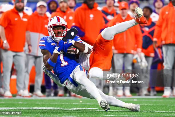 Brashard Smith of the Southern Methodist Mustangs is tackled as he runs the ball during the second half of the ACC Championship game against the...