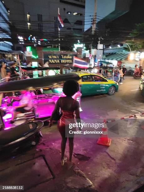 street nightlife in soi nana, sukhumvit, thailand - prostitution stock pictures, royalty-free photos & images