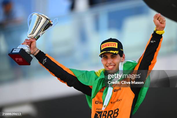 Second placed and 2024 F2 Drivers Champion Gabriel Bortoleto of Brazil and Invicta Racing celebrates on the podium during the Round 14 Yas Island...
