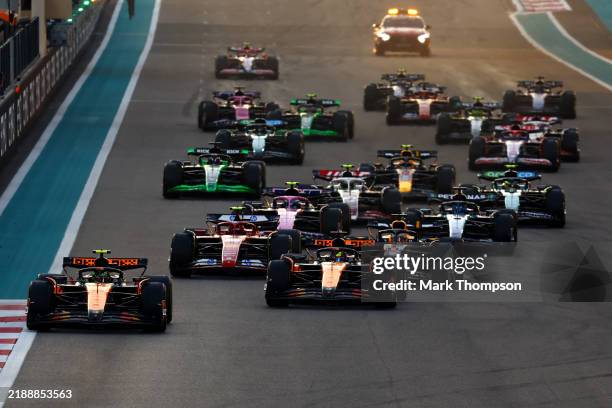 Lando Norris of Great Britain driving the McLaren MCL38 Mercedes leads the field into turn one at the start during the F1 Grand Prix of Abu Dhabi at...