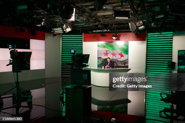News anchor speaks inside the broadcast studio of the General Organization of Radio and TV Syria on December 8, 2024 in Damascus, Syria. Syrian state...