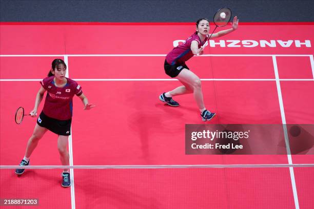 Nami Matsuyama and Chiharu Shida of Japan compete in the Women's Double match against Liu Sheng Shu and Tan Ning of China during day two BWF World...